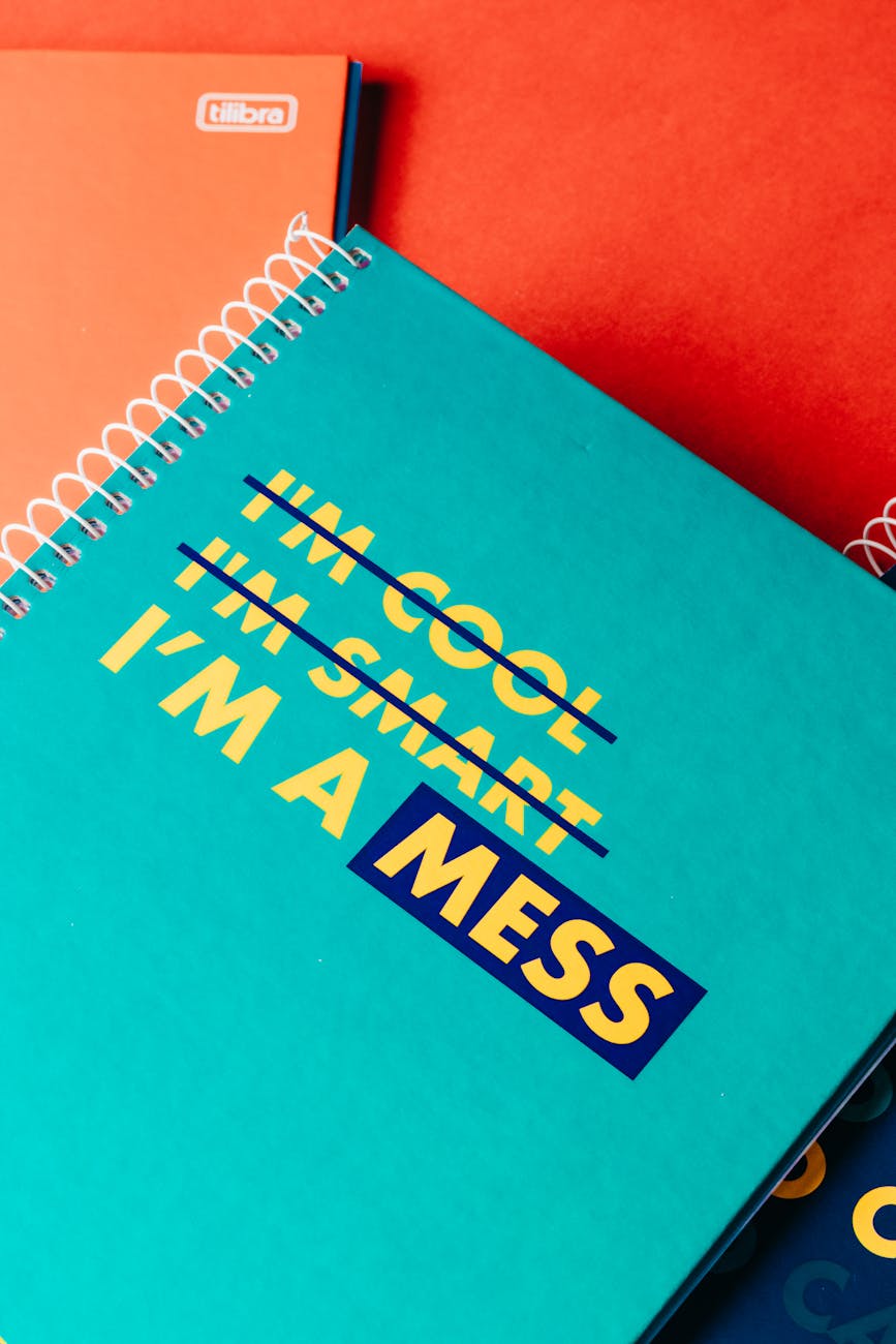 bright paper notebooks on red background